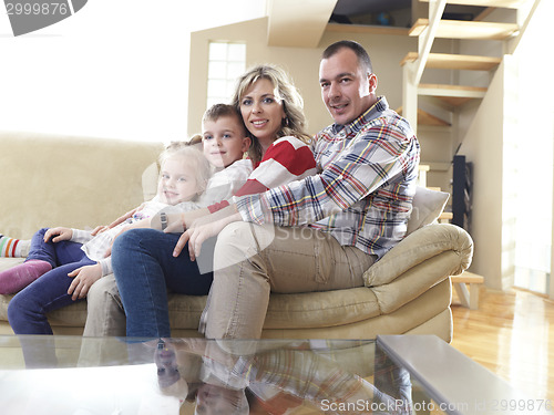 Image of happy young family at home