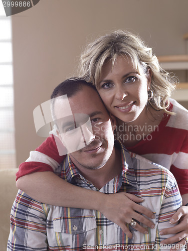 Image of happy couple at home