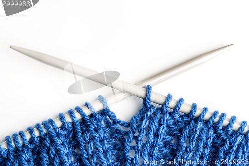 Image of Closeup of a blue knitted scarf
