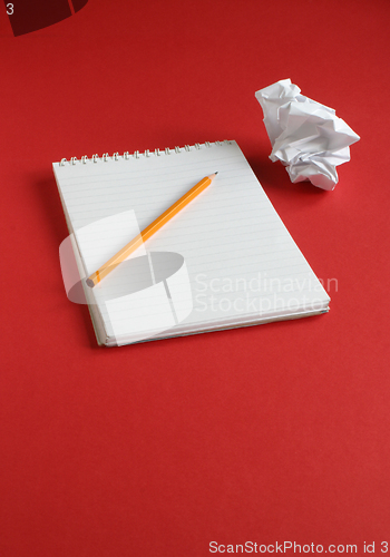 Image of Notepad on red