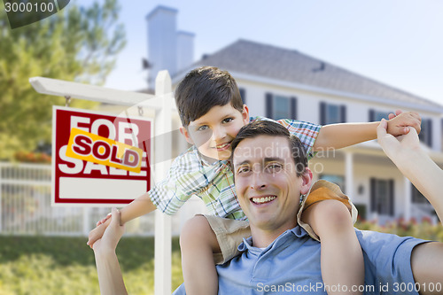 Image of Mixed Race Father, Son Piggyback, Front of House, Sold Sign