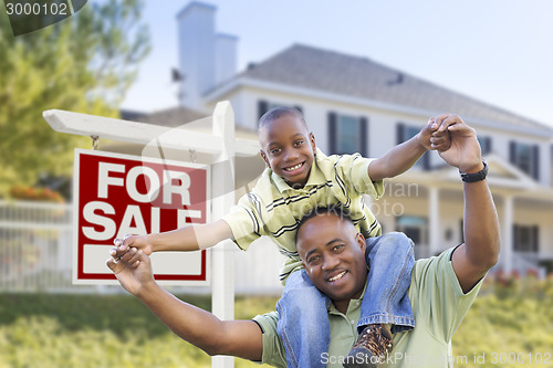 Image of African American Father and Son, Sale Sign and Home