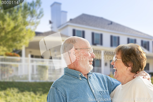 Image of Happy Senior Couple in Front Yard of House