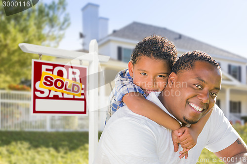 Image of African American Father and Mixed Race Son, Sold Sign, House