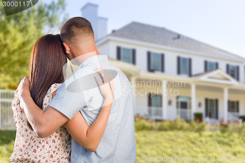 Image of Military Couple Looking at Nice New House