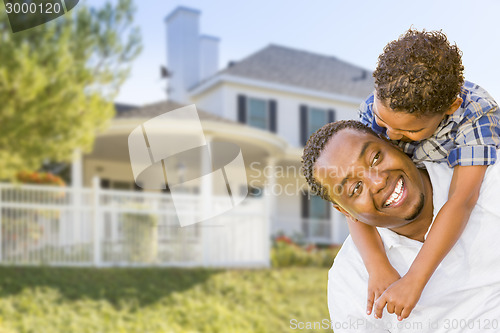 Image of African American Father and Mixed Race Son, House Behind