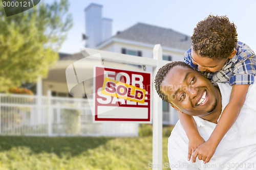 Image of African American Father and Mixed Race Son, Sold Sign, House