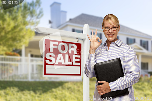 Image of Real Estate Agent in Front of For Sale Sign, House