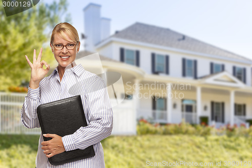 Image of Attractive Businesswoman In Front of Nice Residential Home