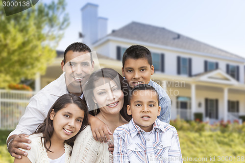 Image of Hispanic Family in Front of Beautiful House