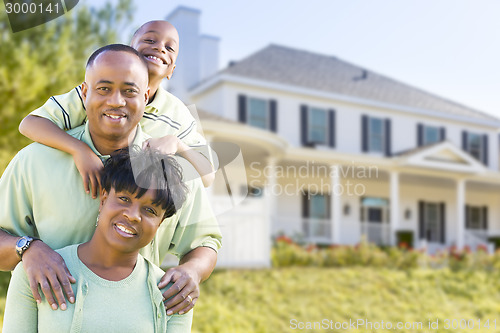 Image of Attractive African American Family in Front of Home