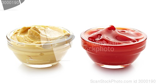 Image of bowls of mustard sauce and ketchup