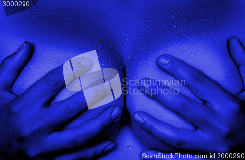 Image of Hands covering breasts