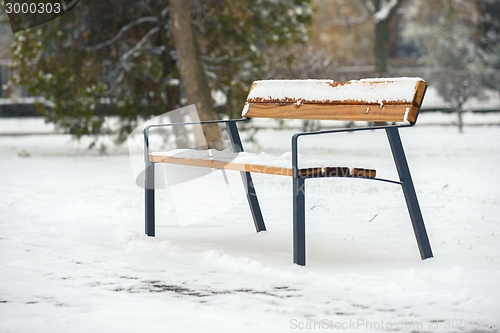 Image of Wooden bench at winter