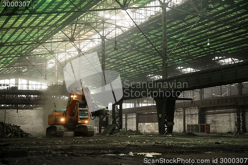 Image of Industrial interior with bulldozer inside