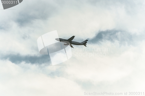 Image of Tranquil sky with airplane traveling