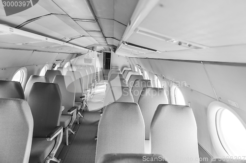 Image of Interior of an airplane with many seats