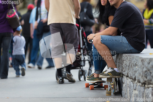 Image of Young couple with skateboards.