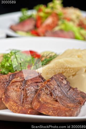 Image of tongue with grilled vegetable