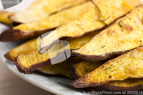 Image of Portion of fresh baked sweet potato wedges