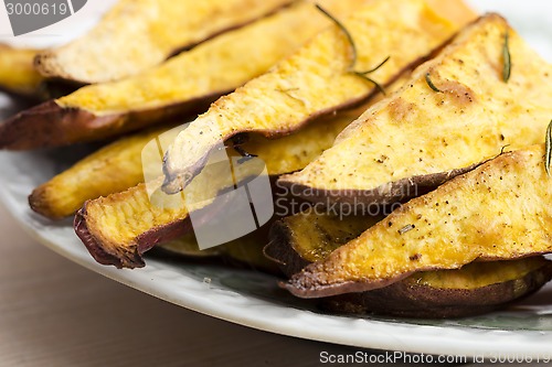 Image of Portion of fresh baked sweet potato wedges