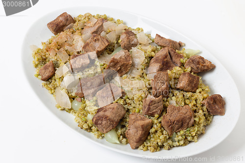 Image of Serving dish of beef with freekeh