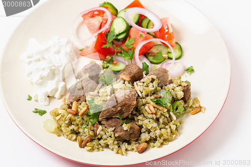 Image of Beef with freekeh high angle view