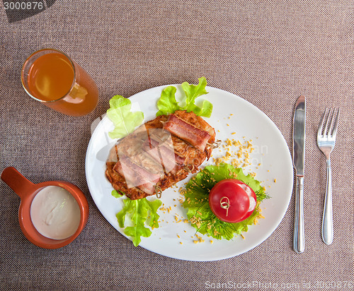 Image of veal meat with bacon