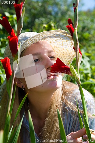 Image of Girl with gladioluses.