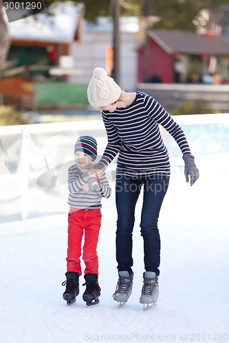 Image of family ice skating