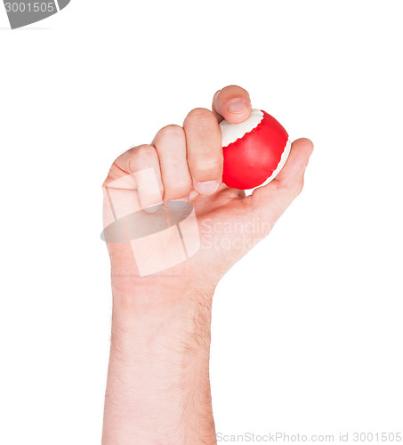 Image of Male hand with a red and white ball