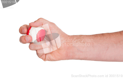 Image of Male hand with a red and white ball