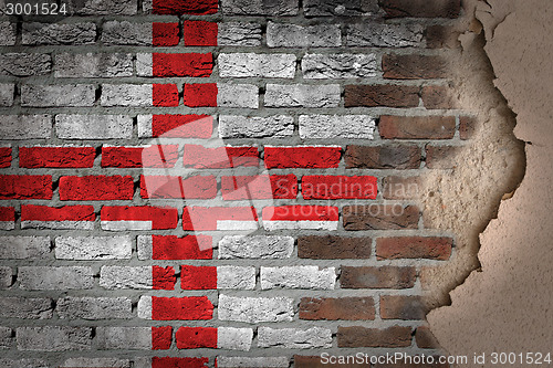 Image of Dark brick wall with plaster - England