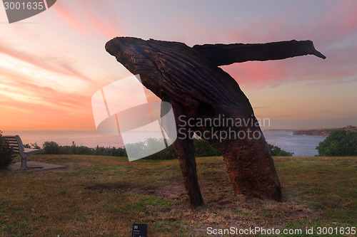 Image of Breaching whale sculpure of wood