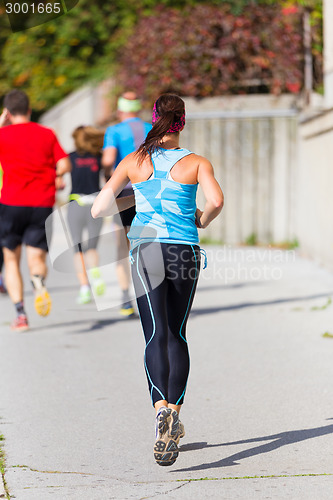 Image of Group of people running.