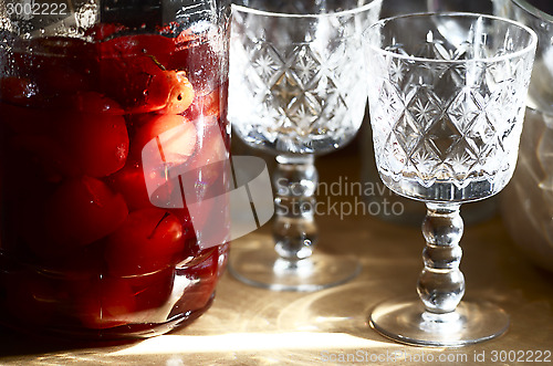 Image of glass jar with canned apples sunlit