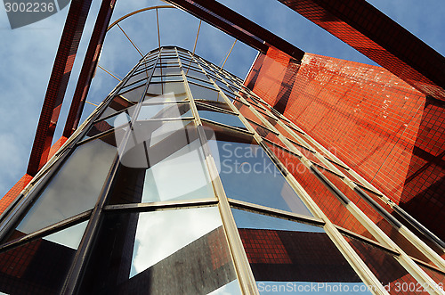 Image of modern office building against blue sky