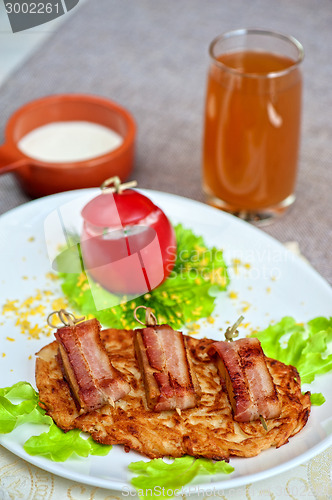 Image of veal meat with bacon