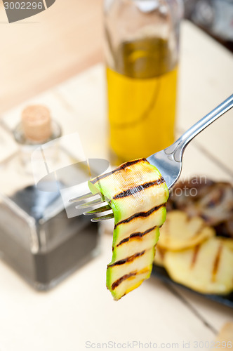 Image of grilled zucchini courgette on a fork
