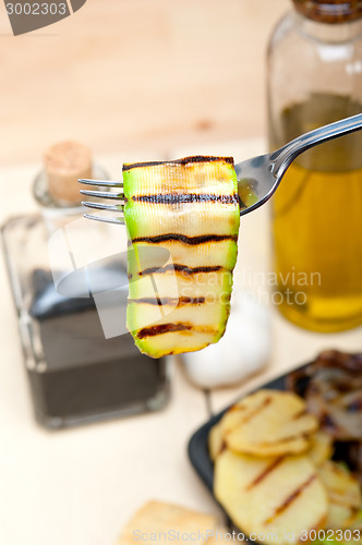 Image of grilled zucchini courgette on a fork