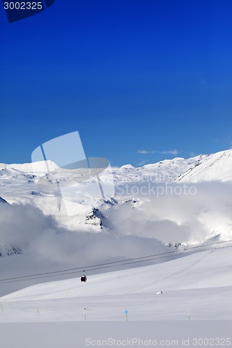 Image of Winter snowy mountains and ski slope at nice day