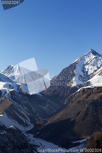 Image of Snowy rocks in evening