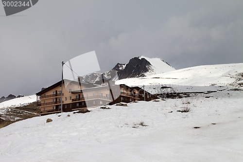 Image of Hotel and ski slope in gray day