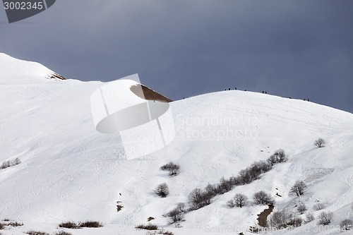 Image of Off piste slope and overcast gray sky in windy day