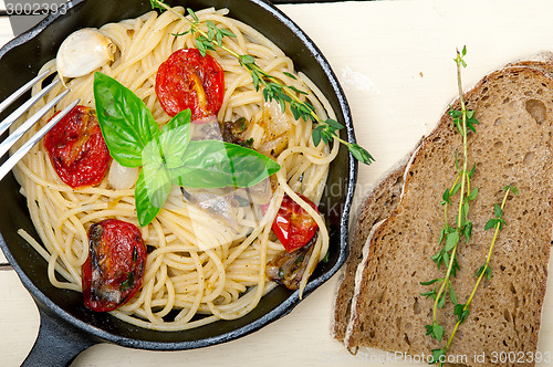 Image of spaghetti pasta with baked cherry tomatoes and basil 