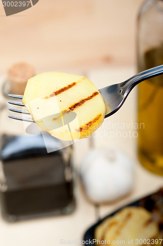 Image of grilled potato on a fork