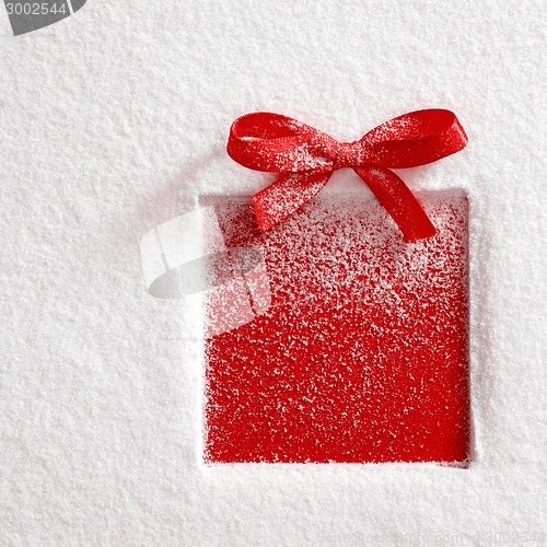 Image of gift on snow background
