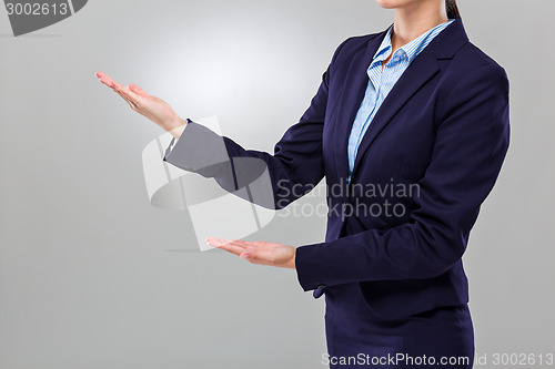 Image of Businesswoman with two hand presentation