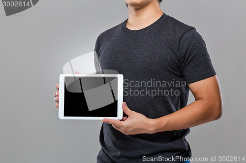 Image of Man hold with blank screen of digital tablet