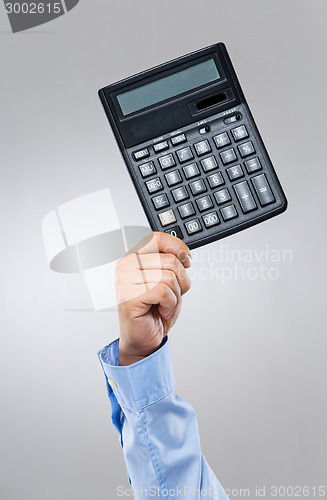 Image of Businessman hold with calculator